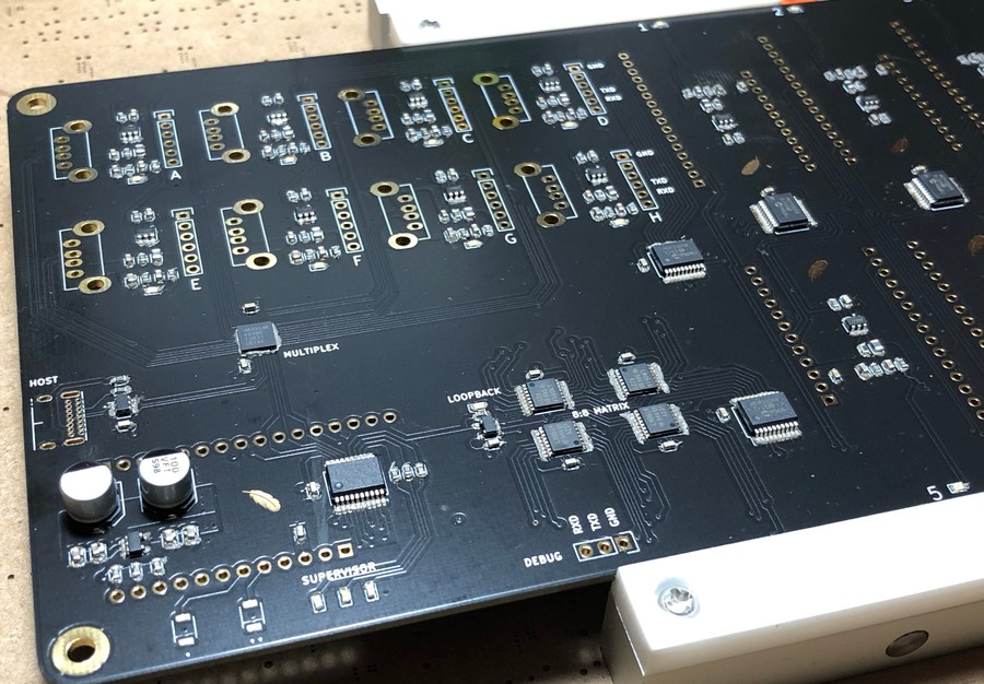 PCB on workbench with paste + components