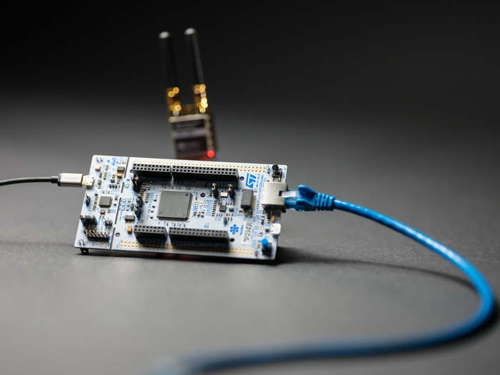 Microcontroller devkit connected to USB, ethernet, radio module